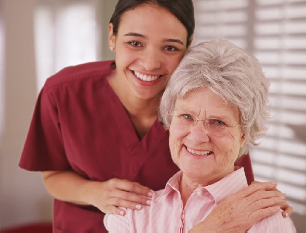 (ROSEWOOD HOME CARE) happy patient is holding caregiver for a hand while spending time together