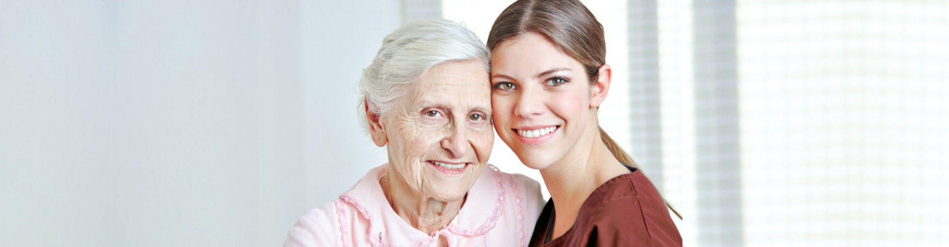 (Rosewood Home Care)caregiver and senior woman smiling