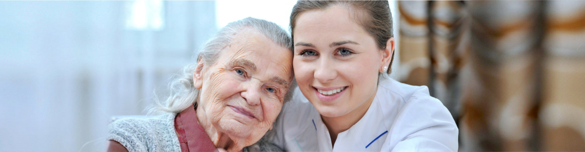 (Rosewood Home Care) Senior woman and female nurse are showing